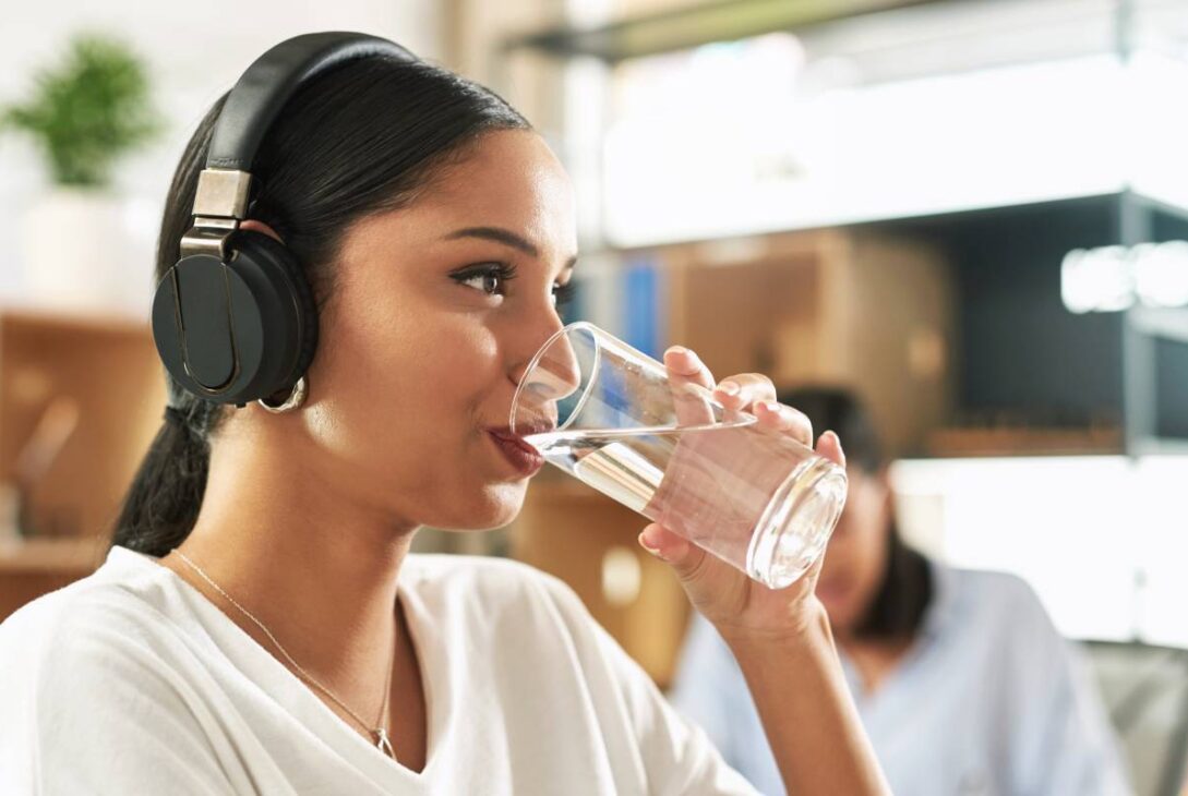 shot of a young businesswoman drinking a glass of 2023 11 27 05 00 22 utc 1