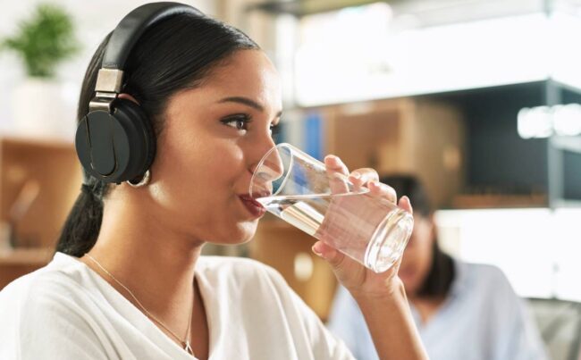 shot of a young businesswoman drinking a glass of 2023 11 27 05 00 22 utc 1